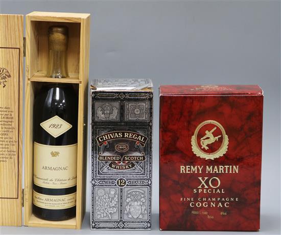 One cased bottle of Chateau de Laubade Armagnac 1923, a boxed bottle of Remy Martin XO Special Cognac and a bottle Chivas Regal Scotch